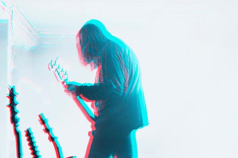 bassist-performing-concert-double-color-exposure-effect_53876-104902